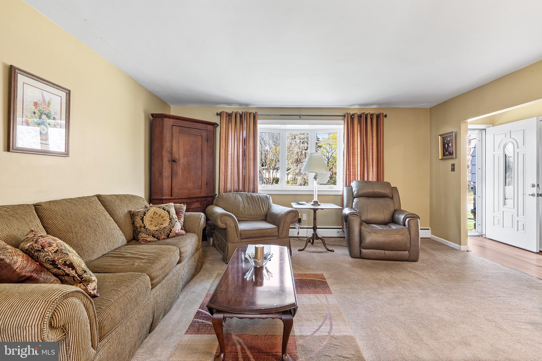 331 North Lehigh Circle Swarthmore, PA 19081 - Photo 5 of 32 a living room with furniture and a large window
