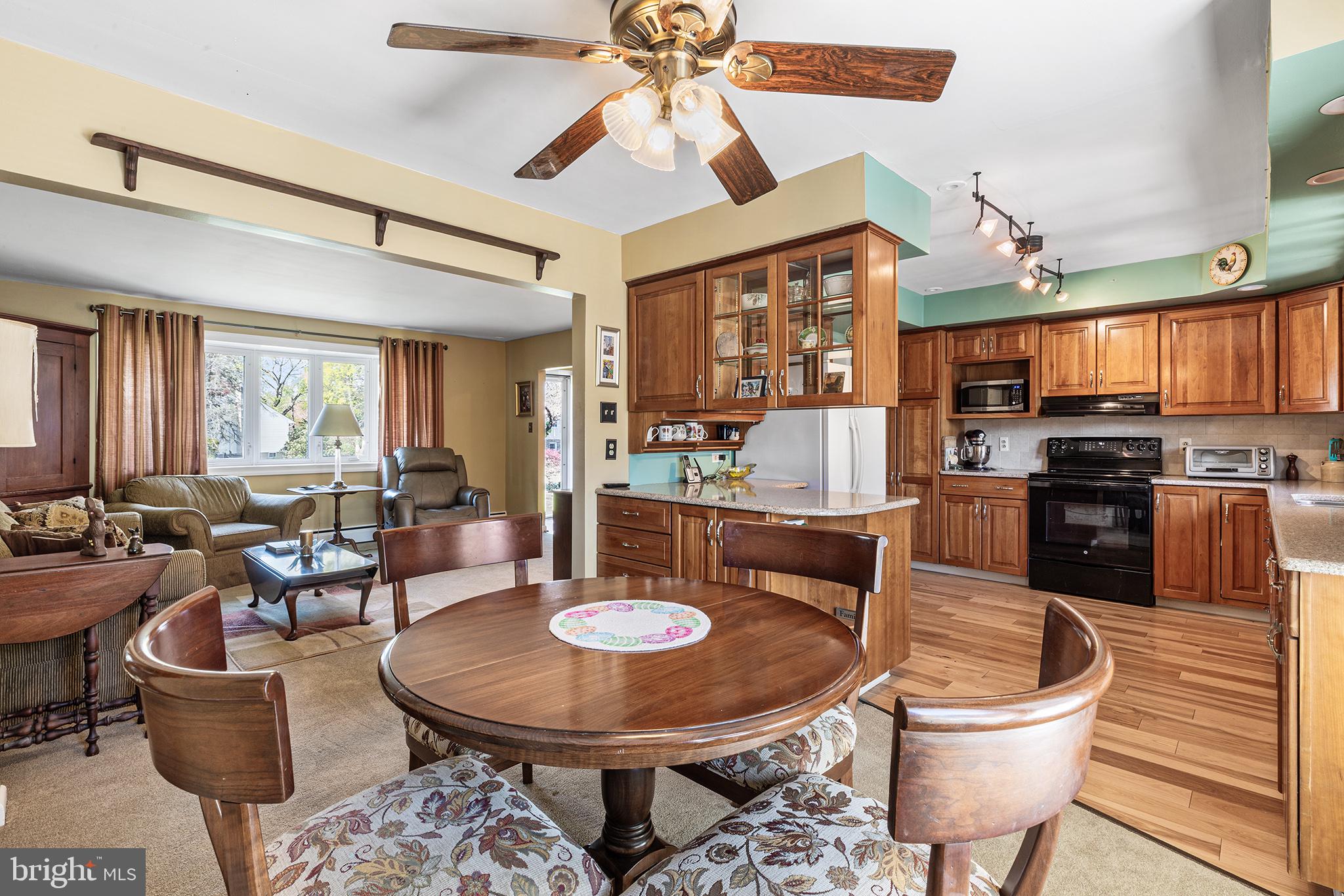 331 North Lehigh Circle Swarthmore, PA 19081 - Photo 8 of 32 a living room with stainless steel appliances kitchen island granite countertop furniture and fireplace