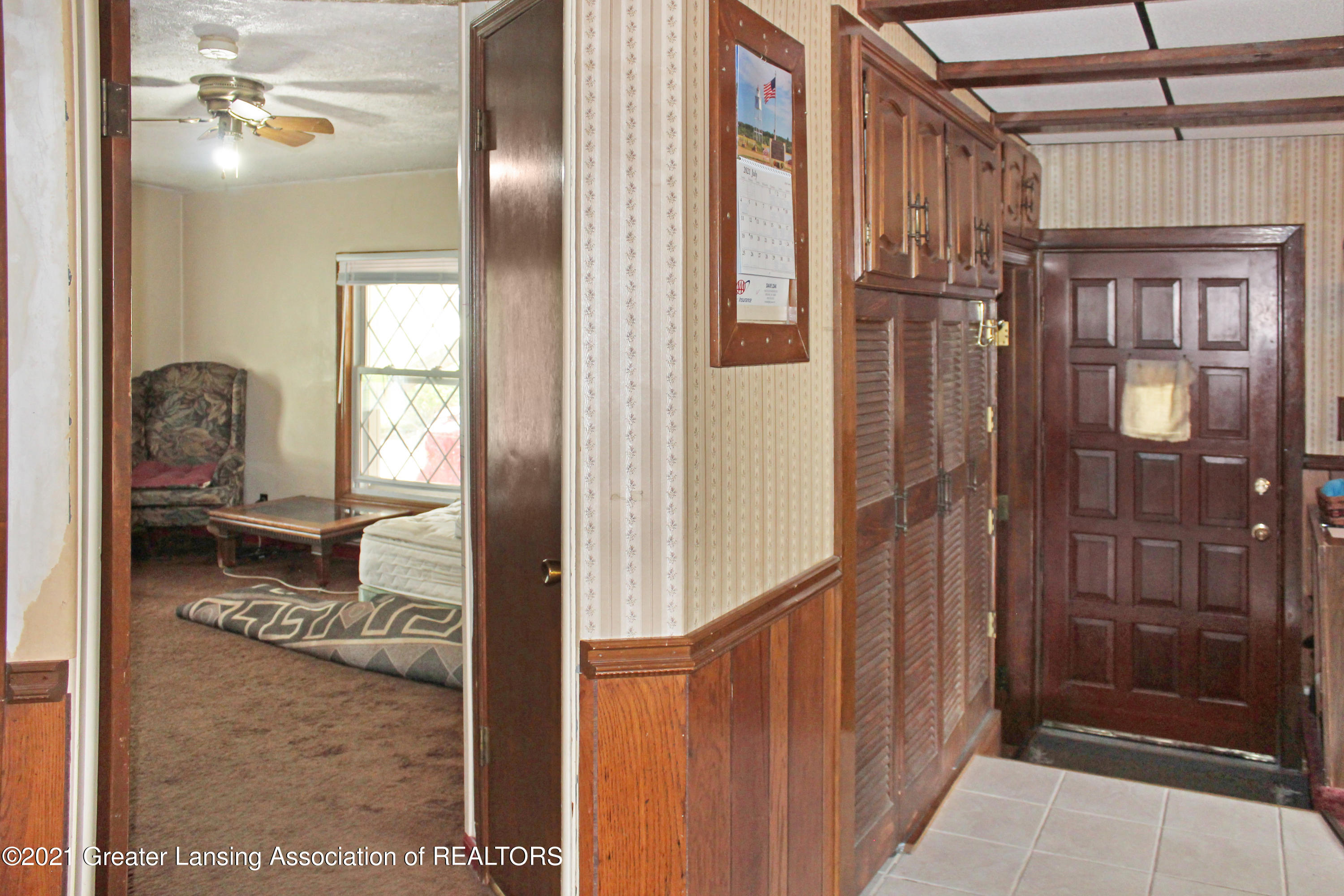 2220 West Jolly Road Lansing, MI 48911 - Photo 19 of 25 Back door/Bedroom 3