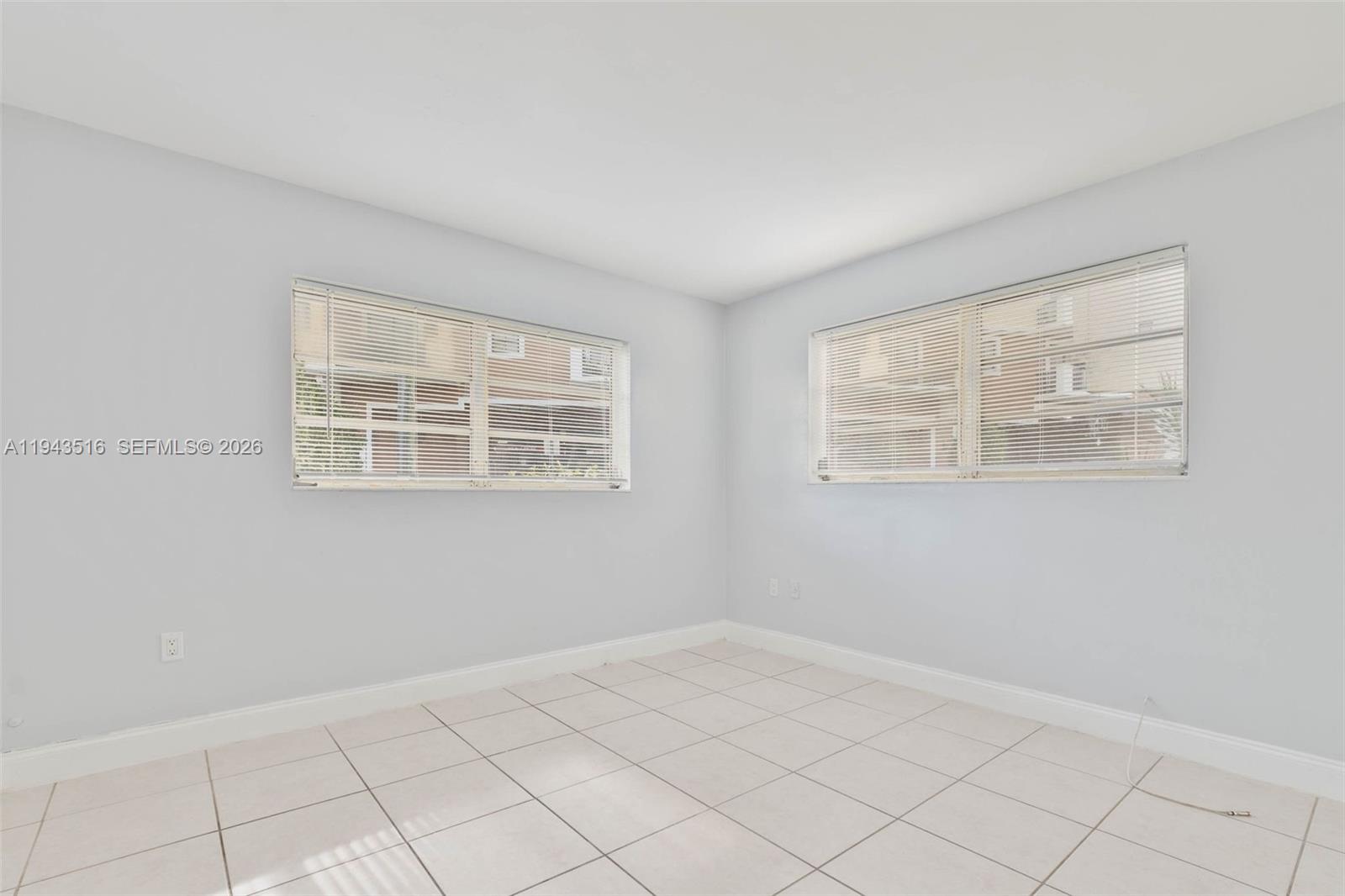 7324 Southwest 82nd Street, Unit B108 Miami, FL 33143 - Photo 13 of 17 a view of an empty room with a window