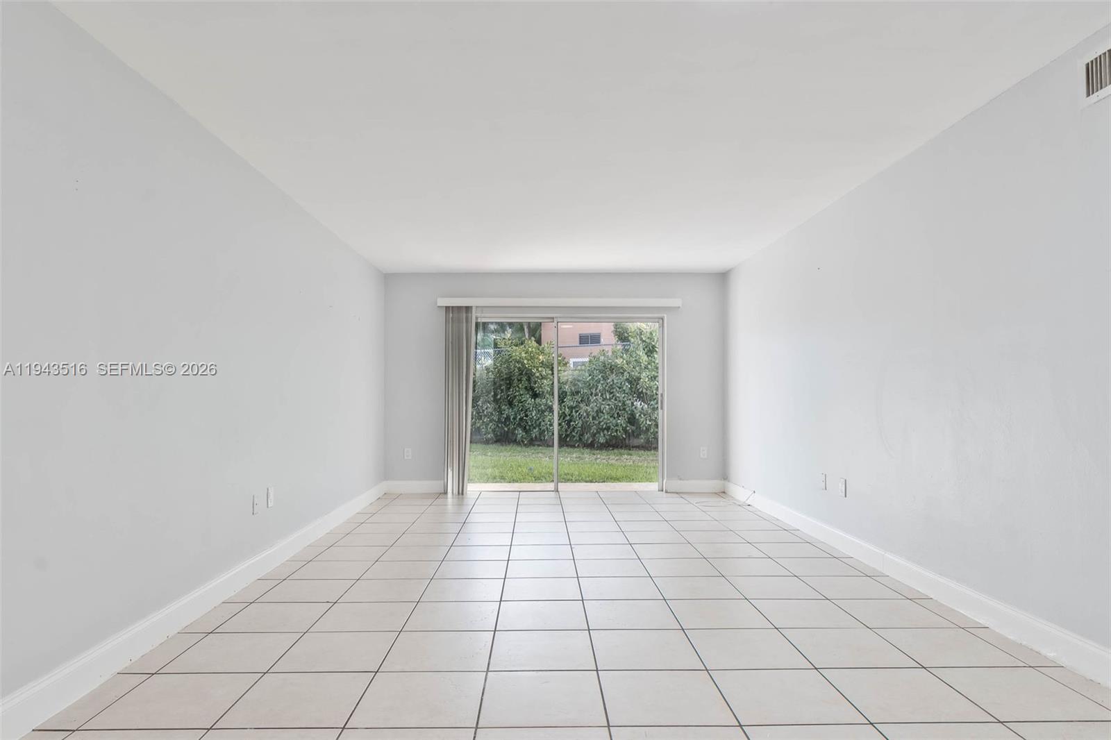 7324 Southwest 82nd Street, Unit B108 Miami, FL 33143 - Photo 2 of 17 a view of an empty room with a window