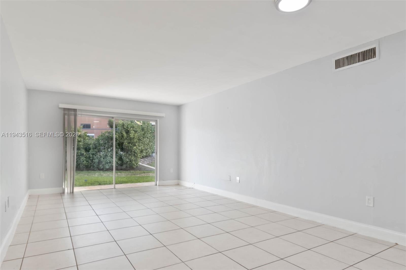 7324 Southwest 82nd Street, Unit B108 Miami, FL 33143 - Photo 3 of 17 a view of an empty room with a window