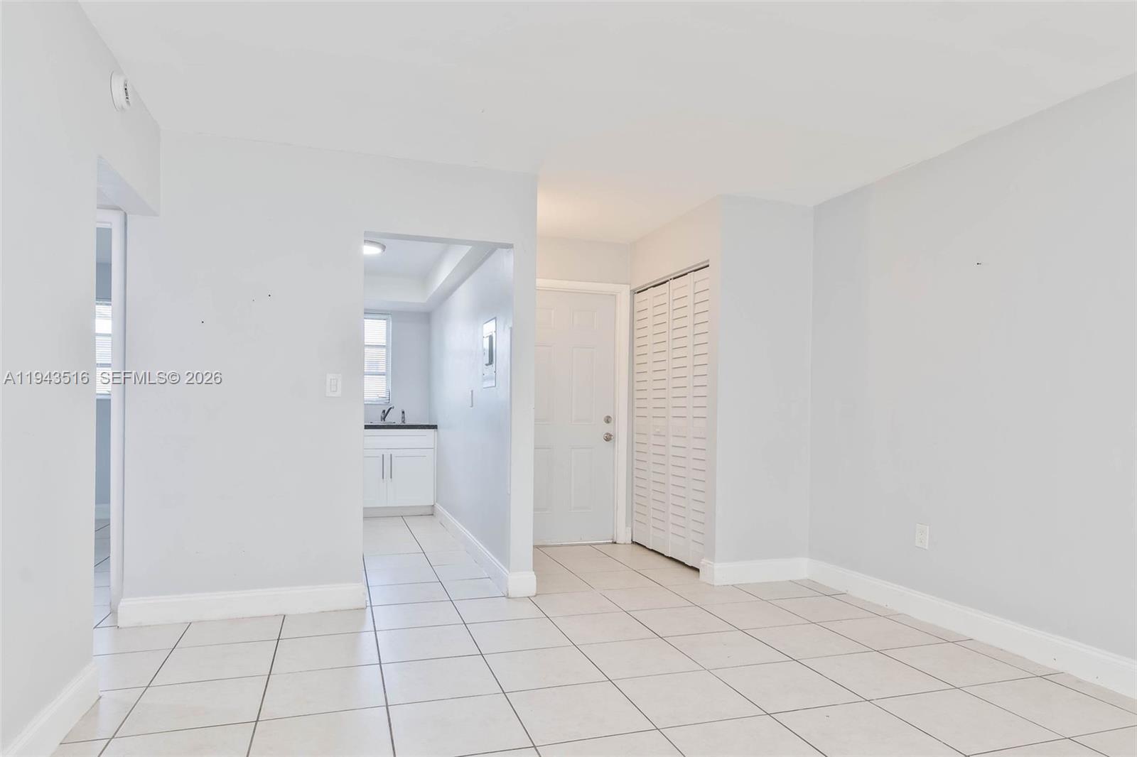 7324 Southwest 82nd Street, Unit B108 Miami, FL 33143 - Photo 6 of 17 a view of an empty room and a bathroom