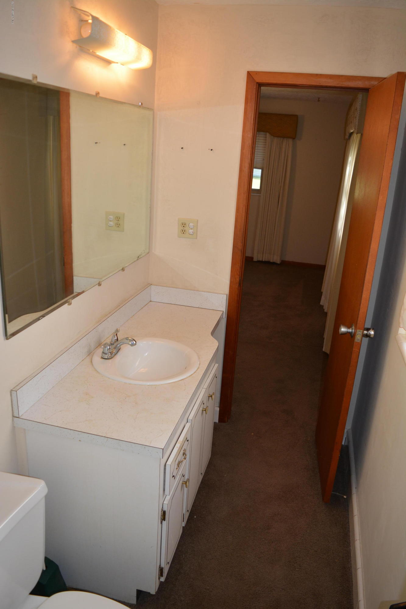 4061 Appaloosa Road Middleburg, FL 32068 - Photo 24 of 43 a bathroom with a sink and mirror with toilet