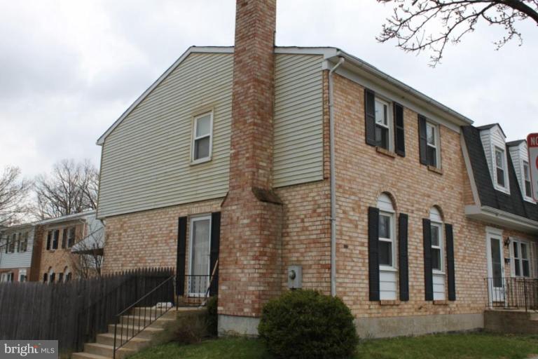 9415 Windpine Road, Unit 9415 Middle River, MD 21220 - Photo 1 of 11 a front view of a house with a yard