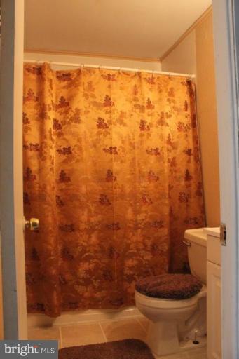 9415 Windpine Road, Unit 9415 Middle River, MD 21220 - Photo 3 of 11 a bathroom with a toilet and a shower
