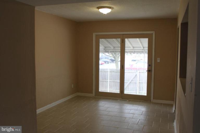 9415 Windpine Road, Unit 9415 Middle River, MD 21220 - Photo 7 of 11 a view of an empty room with a window