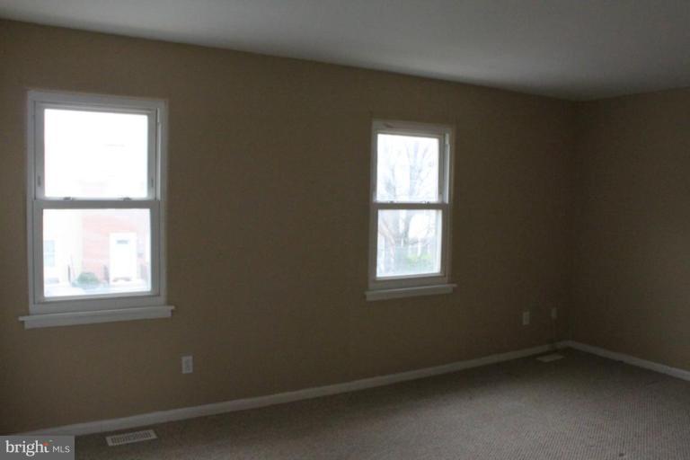 9415 Windpine Road, Unit 9415 Middle River, MD 21220 - Photo 10 of 11 an empty room with a window