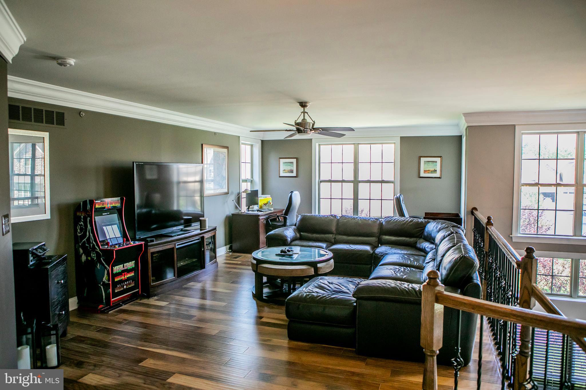 90 Lilac Road Malvern, PA 19355 - Photo 22 of 39 a living room with furniture and a flat screen tv