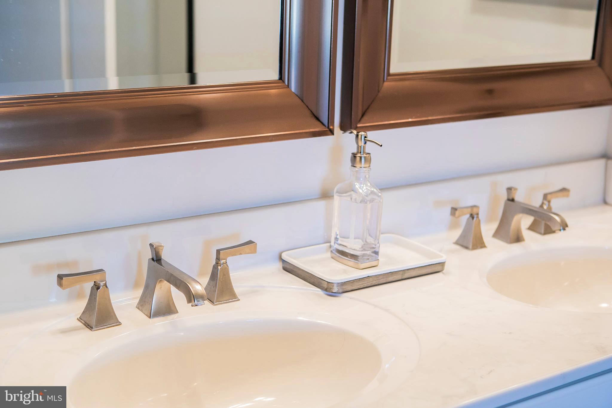 90 Lilac Road Malvern, PA 19355 - Photo 25 of 39 a bathroom with a double vanity sink and a mirror
