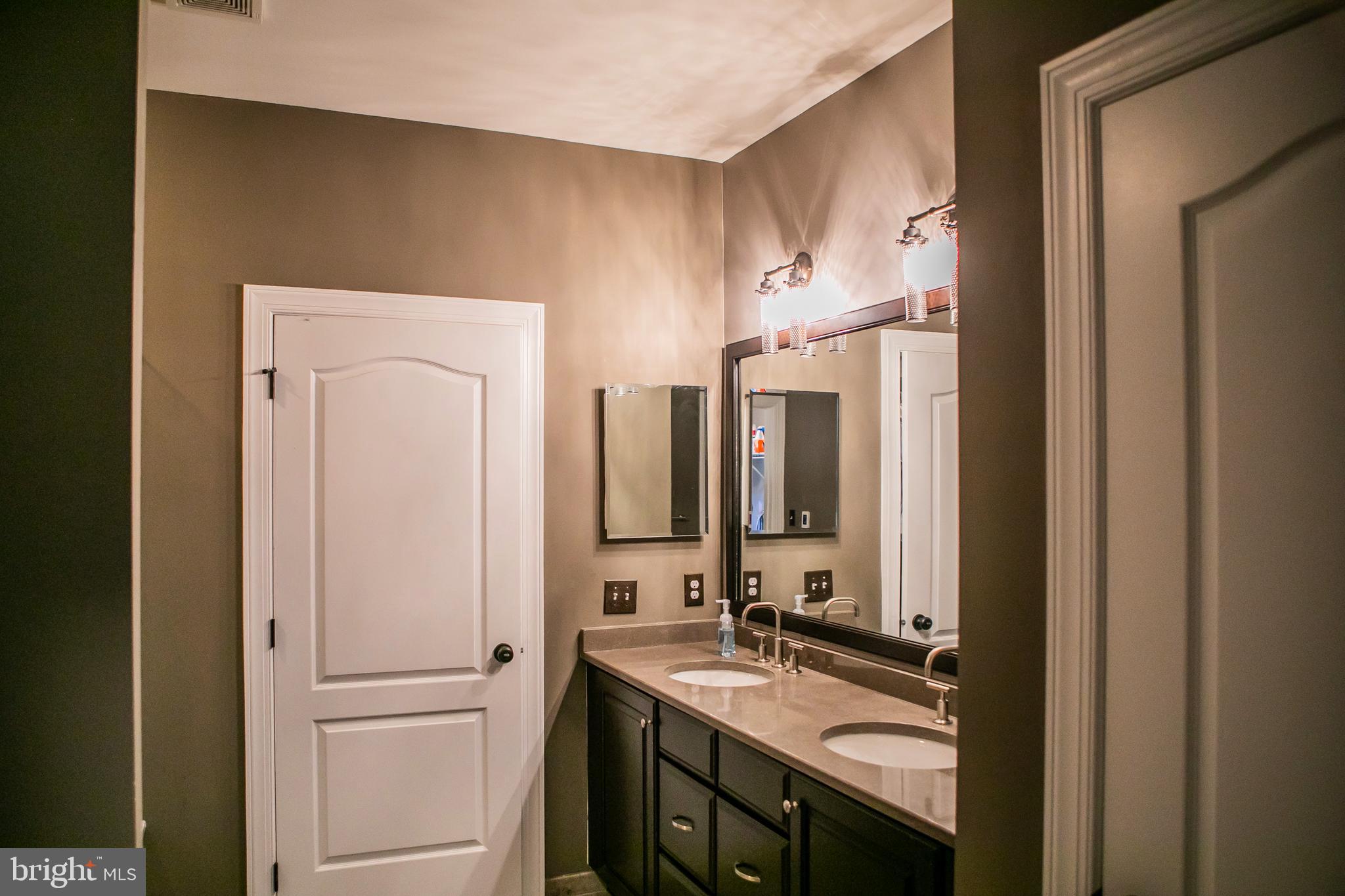 90 Lilac Road Malvern, PA 19355 - Photo 32 of 39 a bathroom with a double vanity sink mirror and