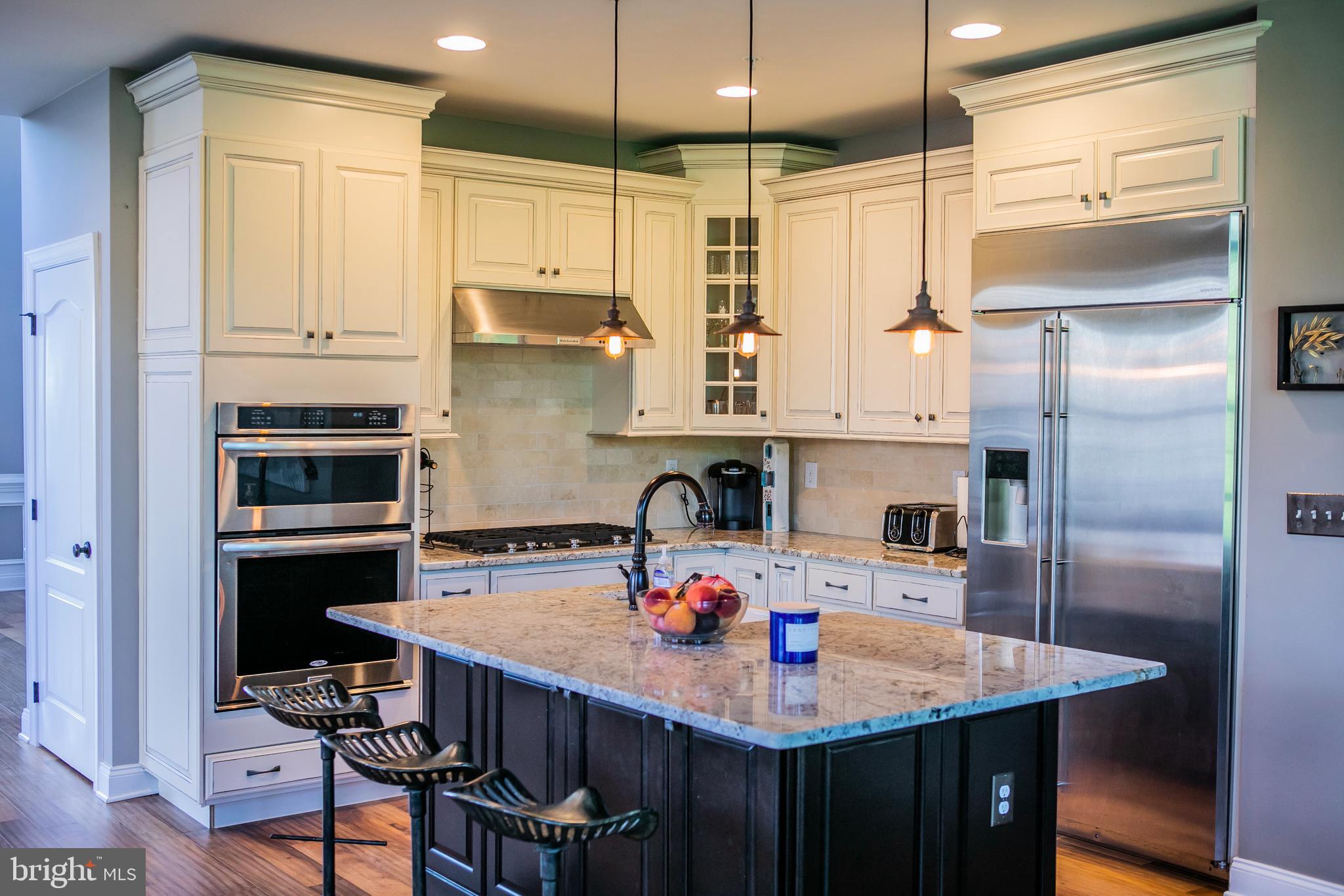 90 Lilac Road Malvern, PA 19355 - Photo 9 of 39 a kitchen with stainless steel appliances granite countertop a sink a stove and a refrigerator