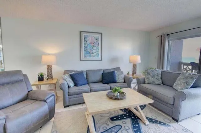 a living room with furniture and a night stand