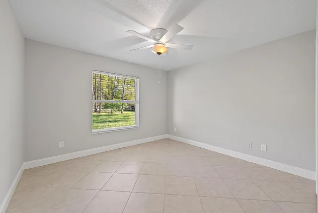 a view of a house with backyard and porch