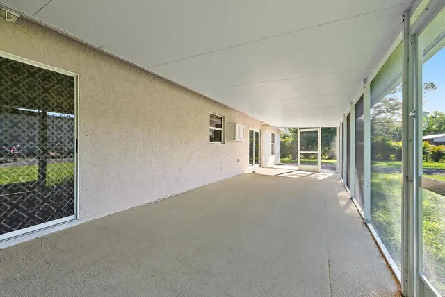 a view of a house with backyard and a garden