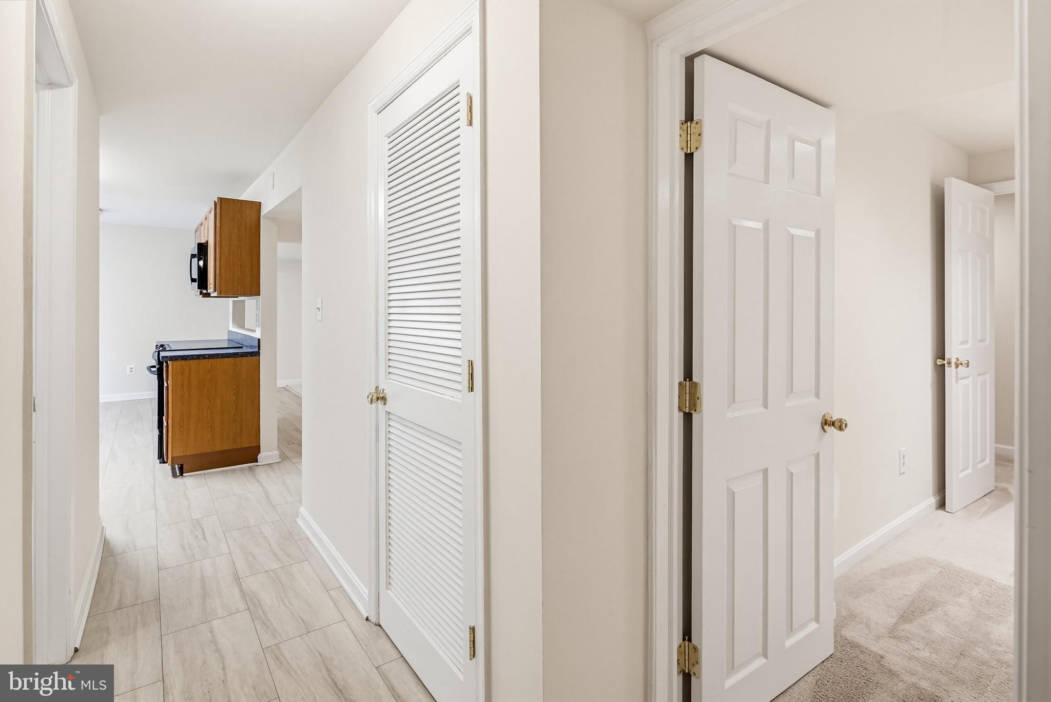 8266 Spring Branch Court Laurel, MD 20723 - Photo 56 of 73 Hallway in lower level to rooms & full bathroom