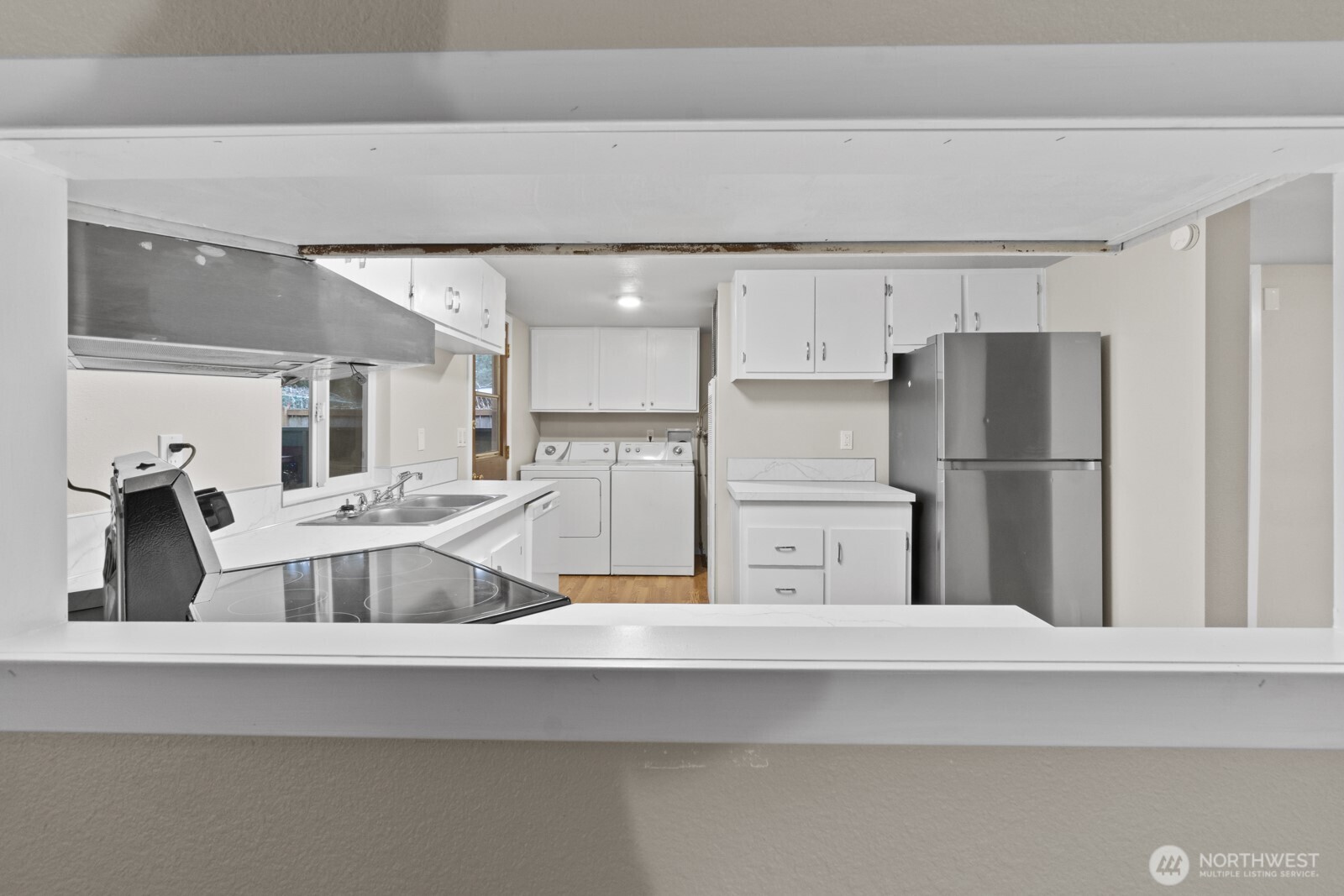 510 Duterrow Road Southeast, Unit 4 Olympia, WA 98513 - Photo 14 of 37 a kitchen with a refrigerator and a sink