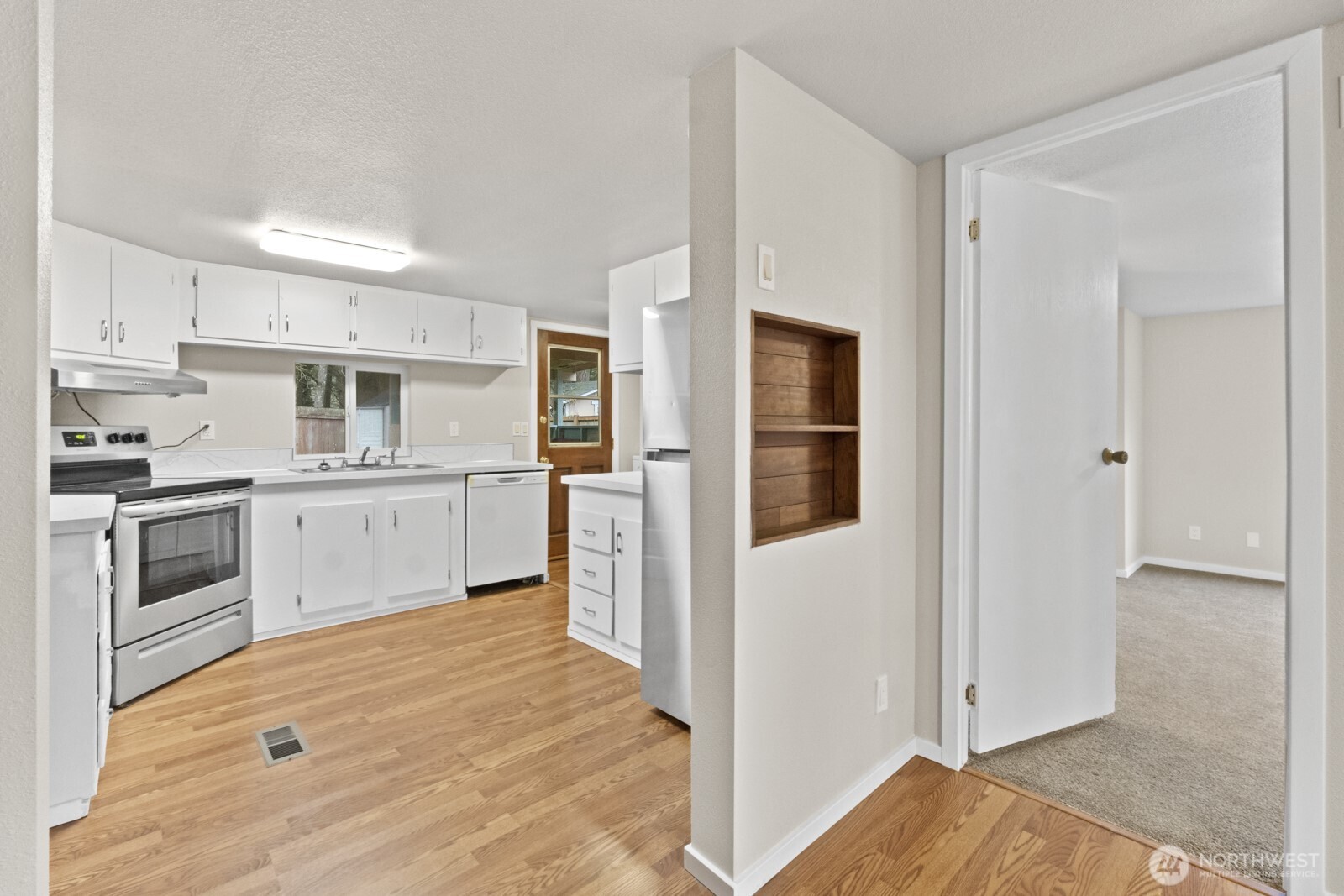 510 Duterrow Road Southeast, Unit 4 Olympia, WA 98513 - Photo 15 of 37 a kitchen with cabinets and stainless steel appliances