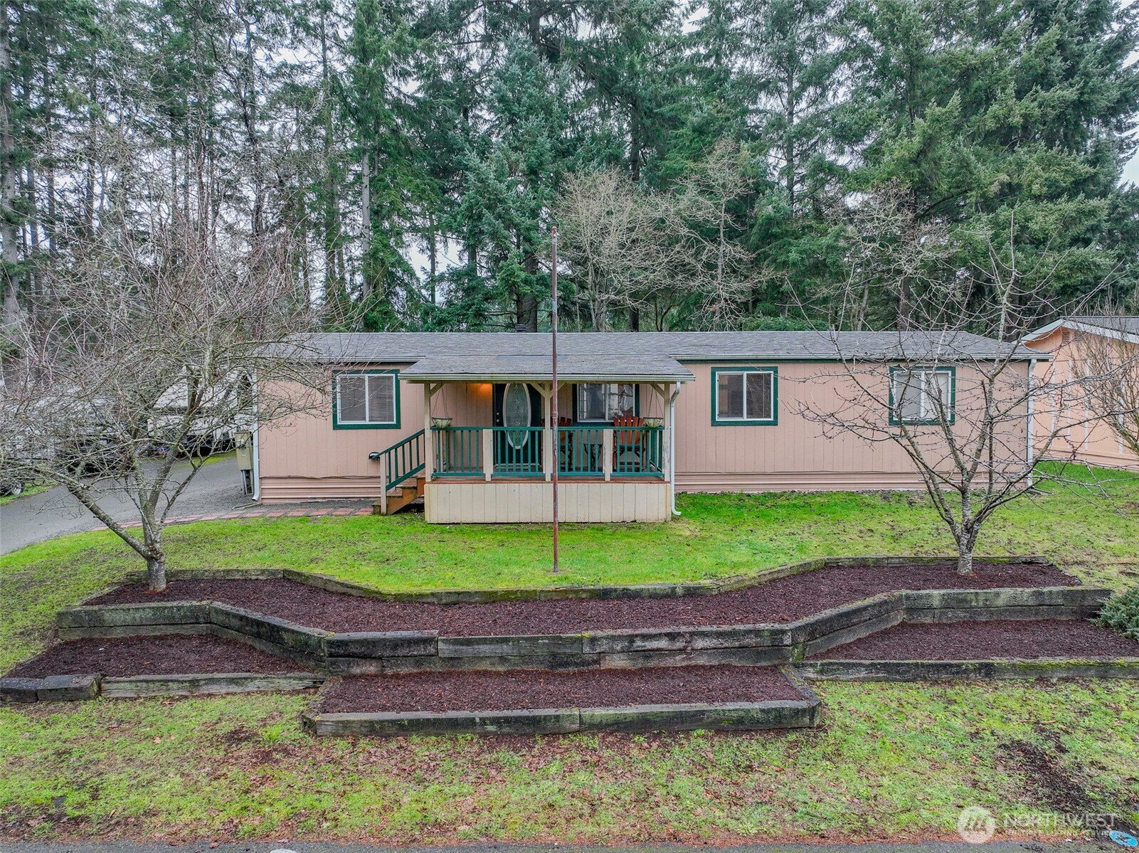 510 Duterrow Road Southeast, Unit 4 Olympia, WA 98513 - Photo 35 of 37 a view of a house with a yard and a patio