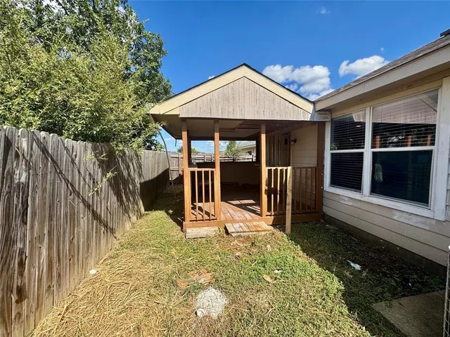 a view of a kitchen with a sink and a stove top oven