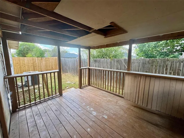a balcony with wooden floor