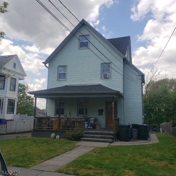 166 Carmita Avenue Rutherford, NJ 07070 - Photo 27 of 27 a front view of a house with a garden