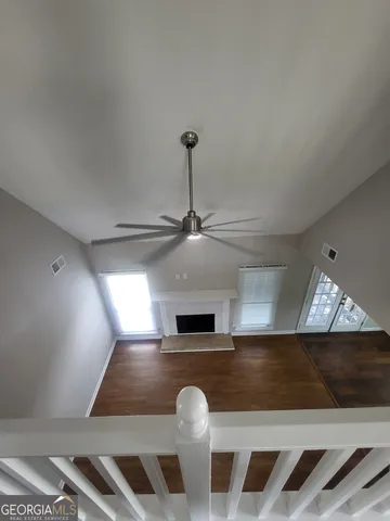 a living room with couches chairs and a fireplace