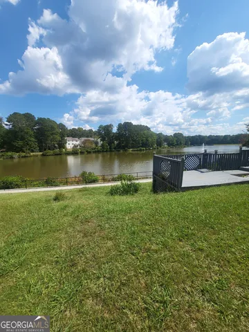 a view of a lake with houses in the back