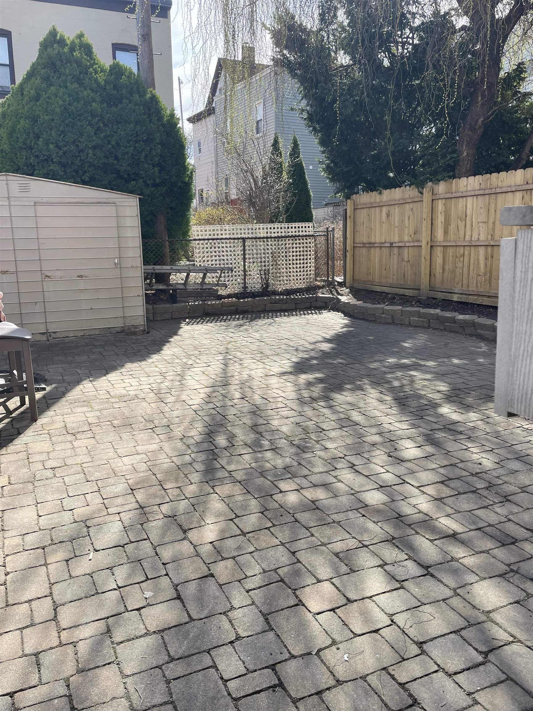 148 Nesbit Street, Unit 1 Weehawken, NJ 07086 - Photo 12 of 13 a view of a yard with wooden fence