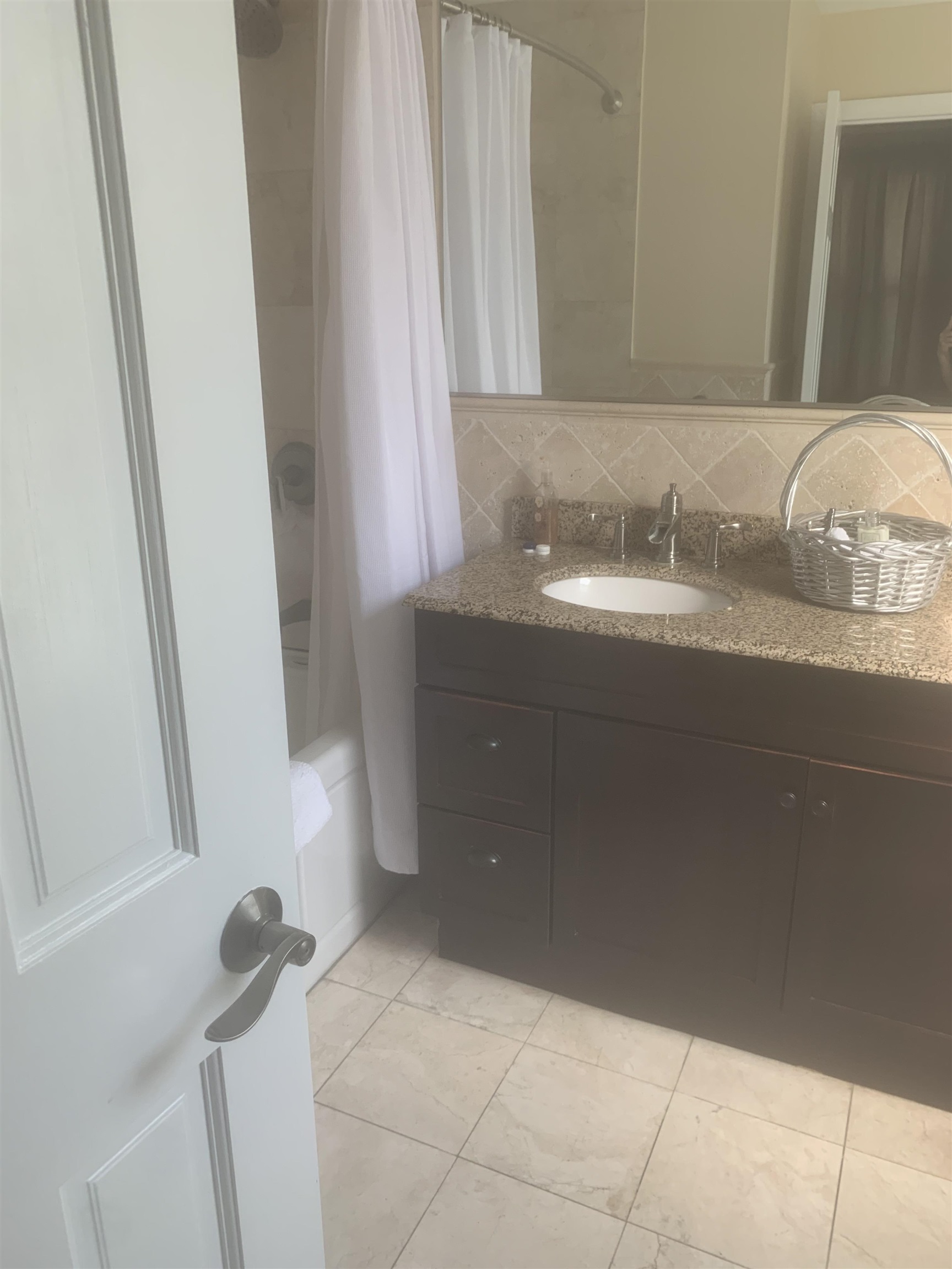 148 Nesbit Street, Unit 1 Weehawken, NJ 07086 - Photo 8 of 13 a bathroom with a granite countertop sink and a mirror