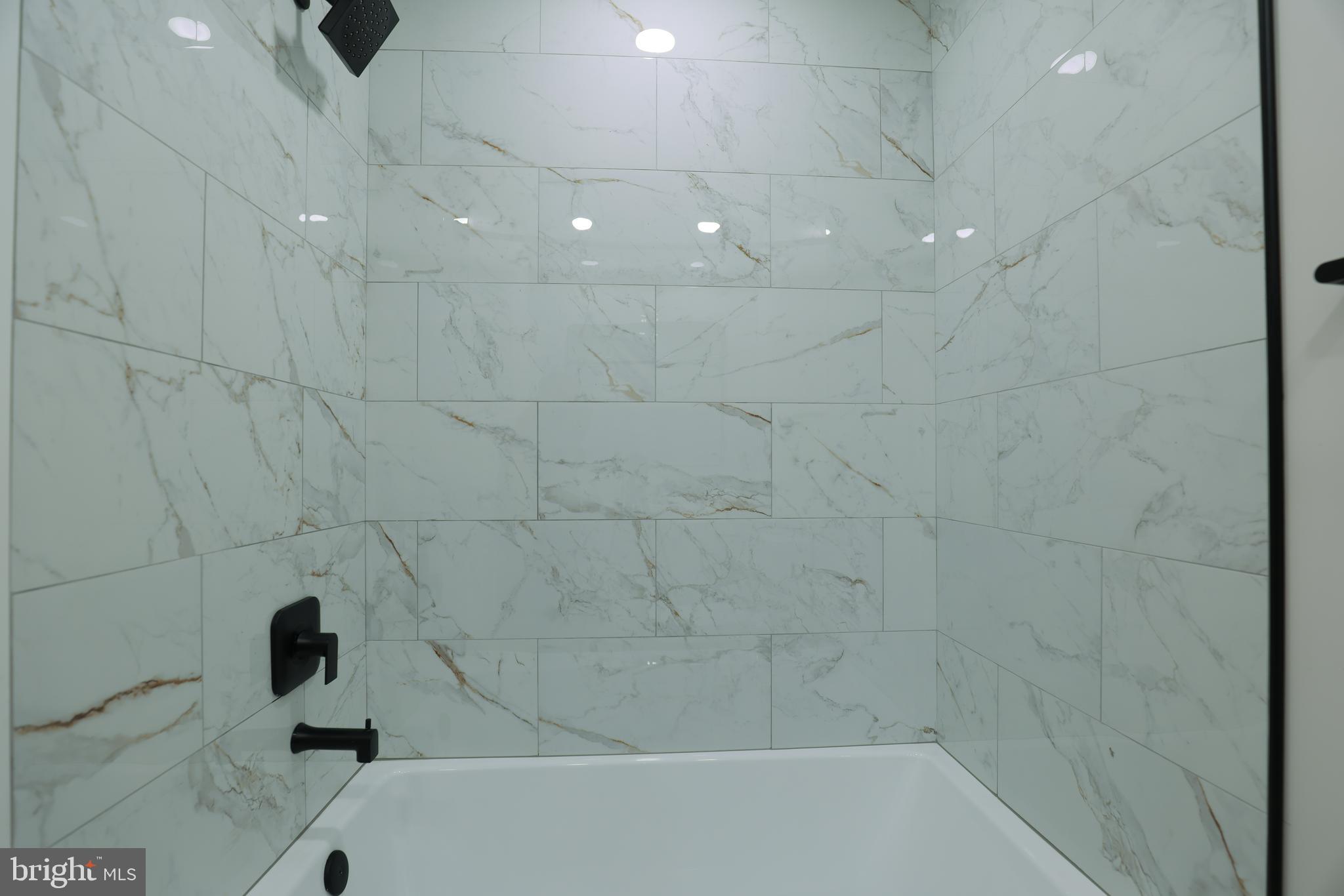 2039 Rosedale Street Northeast Washington, DC 20002 - Photo 12 of 18 a bathroom with a bathtub