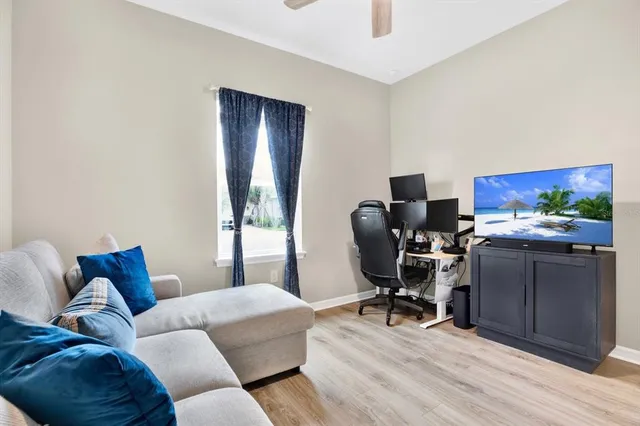 a living room with furniture and a window