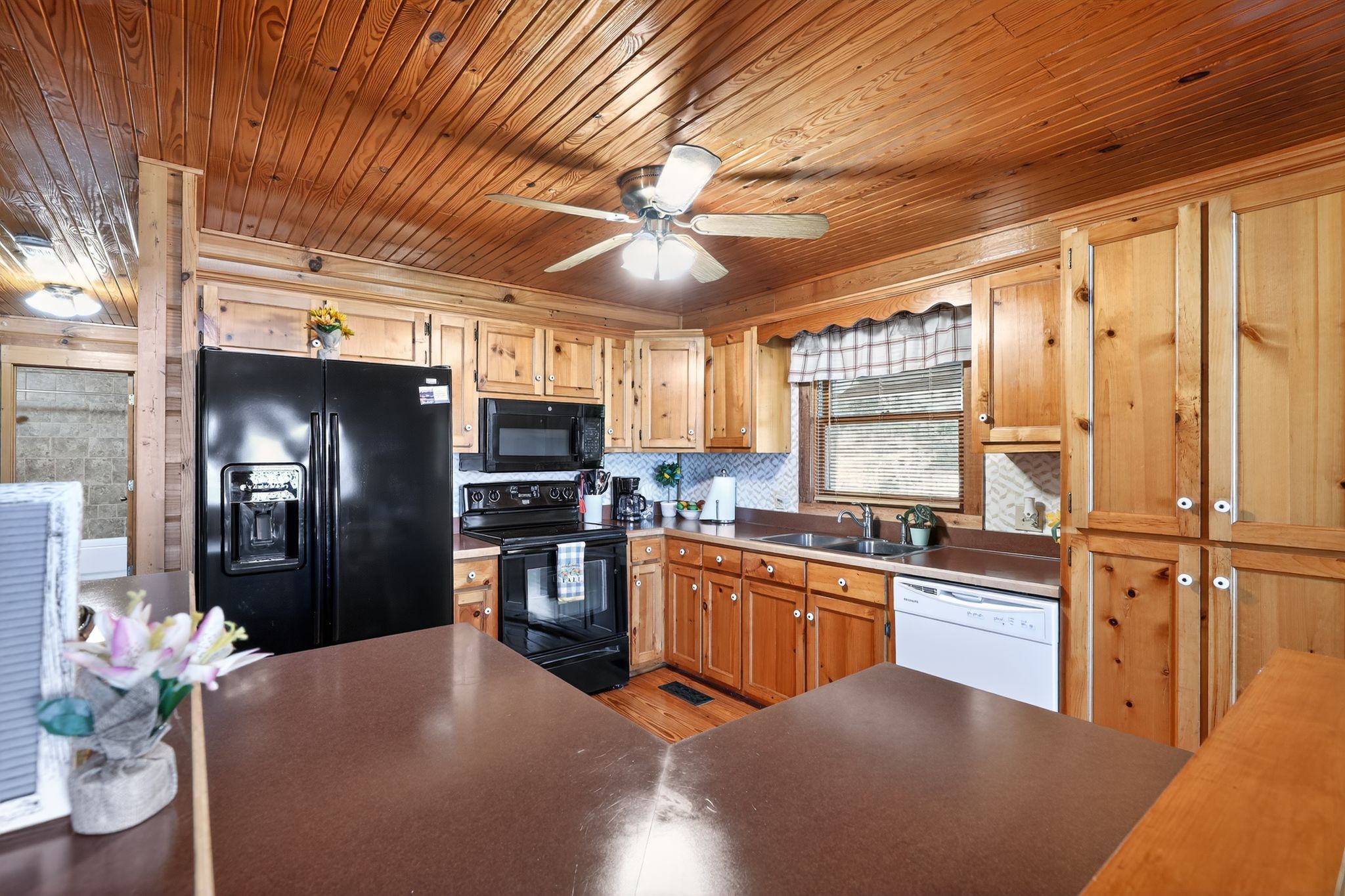 1794 Roberts Road Watertown, TN 37184 - Photo 19 of 38 a kitchen with stainless steel appliances kitchen island granite countertop a refrigerator stove top oven dining table and chairs