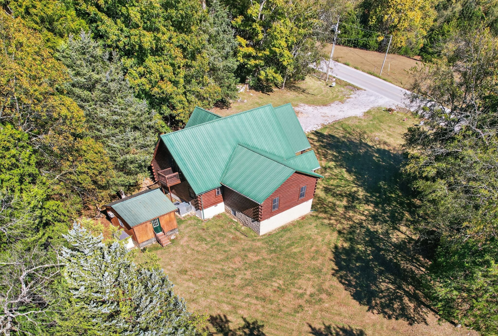 1794 Roberts Road Watertown, TN 37184 - Photo 2 of 38 an aerial view of a house with backyard and trees