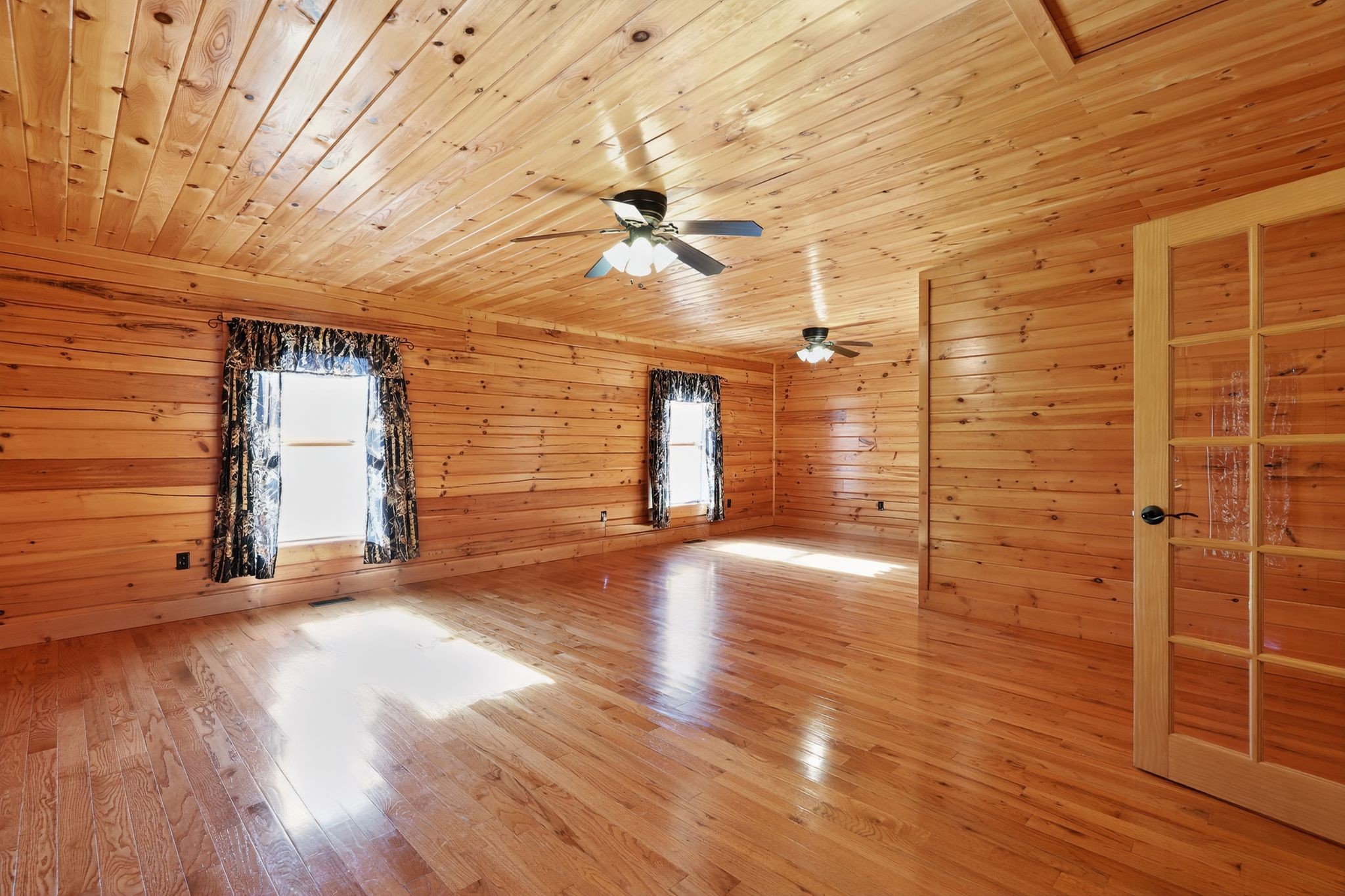 1794 Roberts Road Watertown, TN 37184 - Photo 28 of 38 a view of a livingroom with wooden floor and a ceiling fan