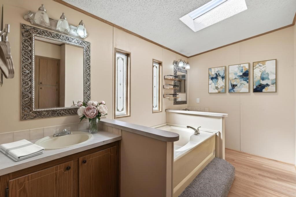 2744 Roy Sikes Road Hilliard, FL 32046 - Photo 57 of 97 a bathroom with a sink double vanity granite and a mirror