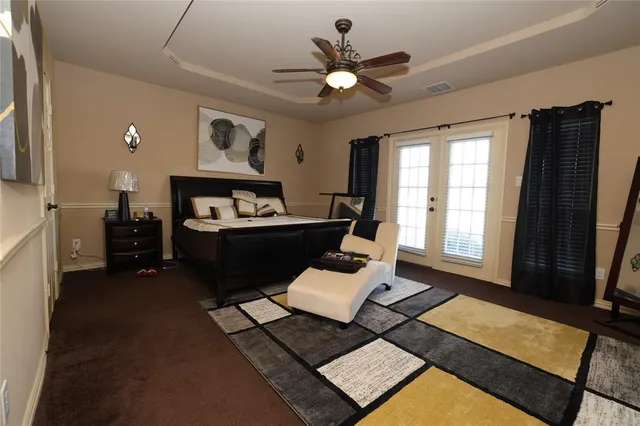 a living room with furniture and a rug