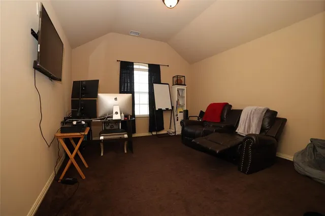 a bed room with a bed and a tv