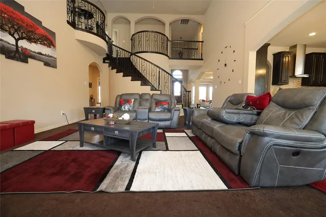 a large kitchen with a table and chairs