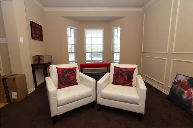 a dining room with furniture and window