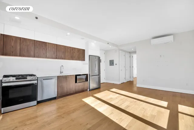 a kitchen with granite countertop a stove and a refrigerator