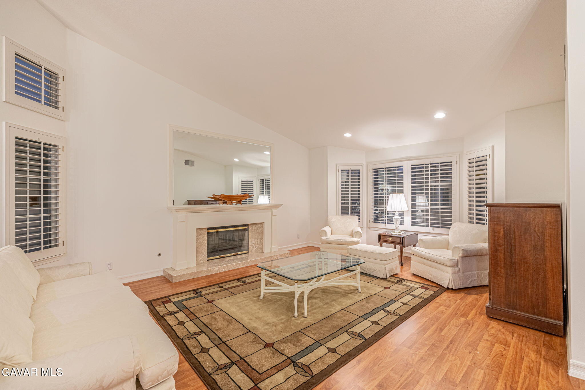 19809 Winged Foot Way Porter Ranch, CA 91326 - Photo 12 of 70 a living room with furniture a fireplace and wooden floor