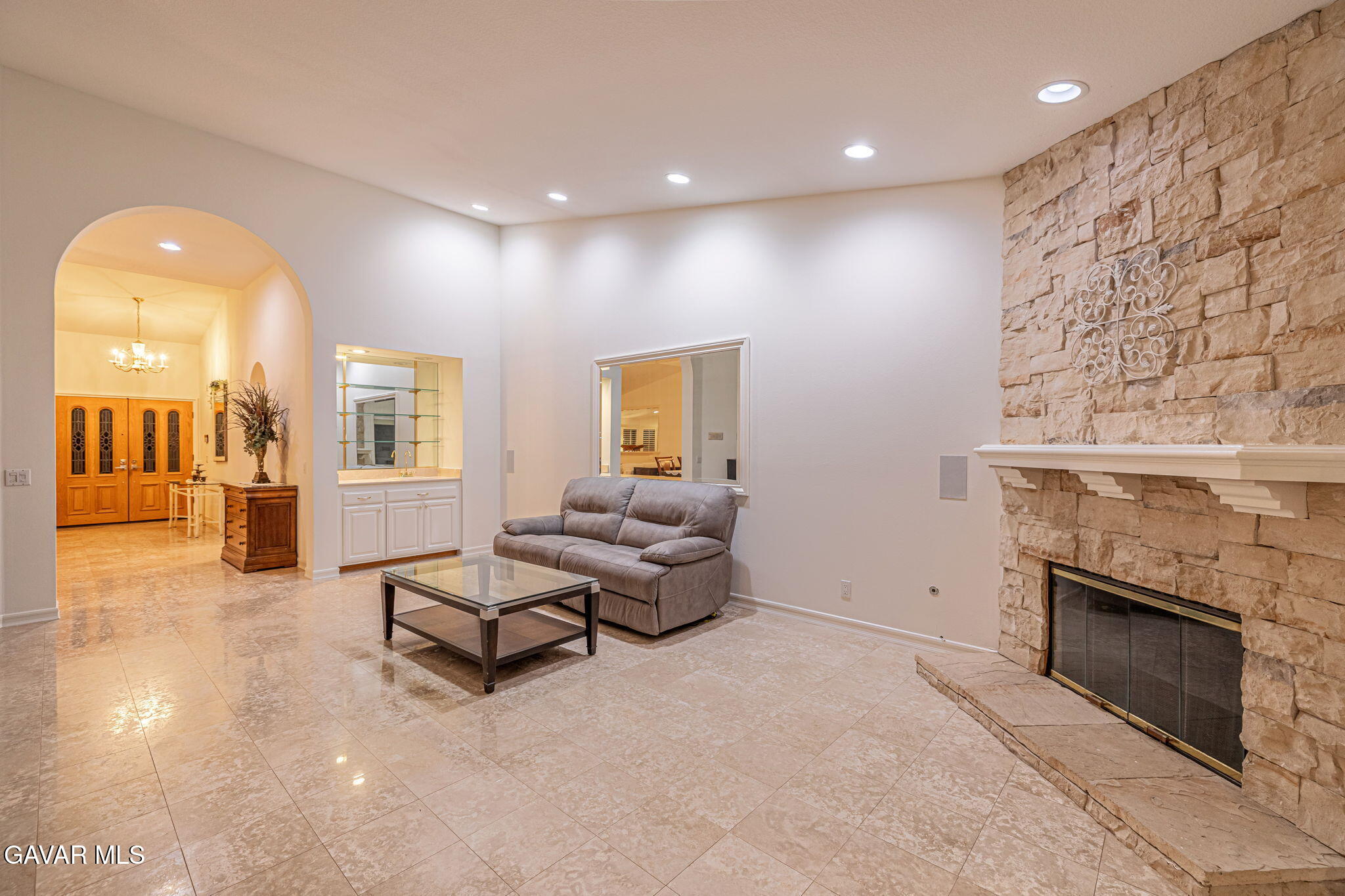 19809 Winged Foot Way Porter Ranch, CA 91326 - Photo 18 of 70 a living room with furniture and a fireplace