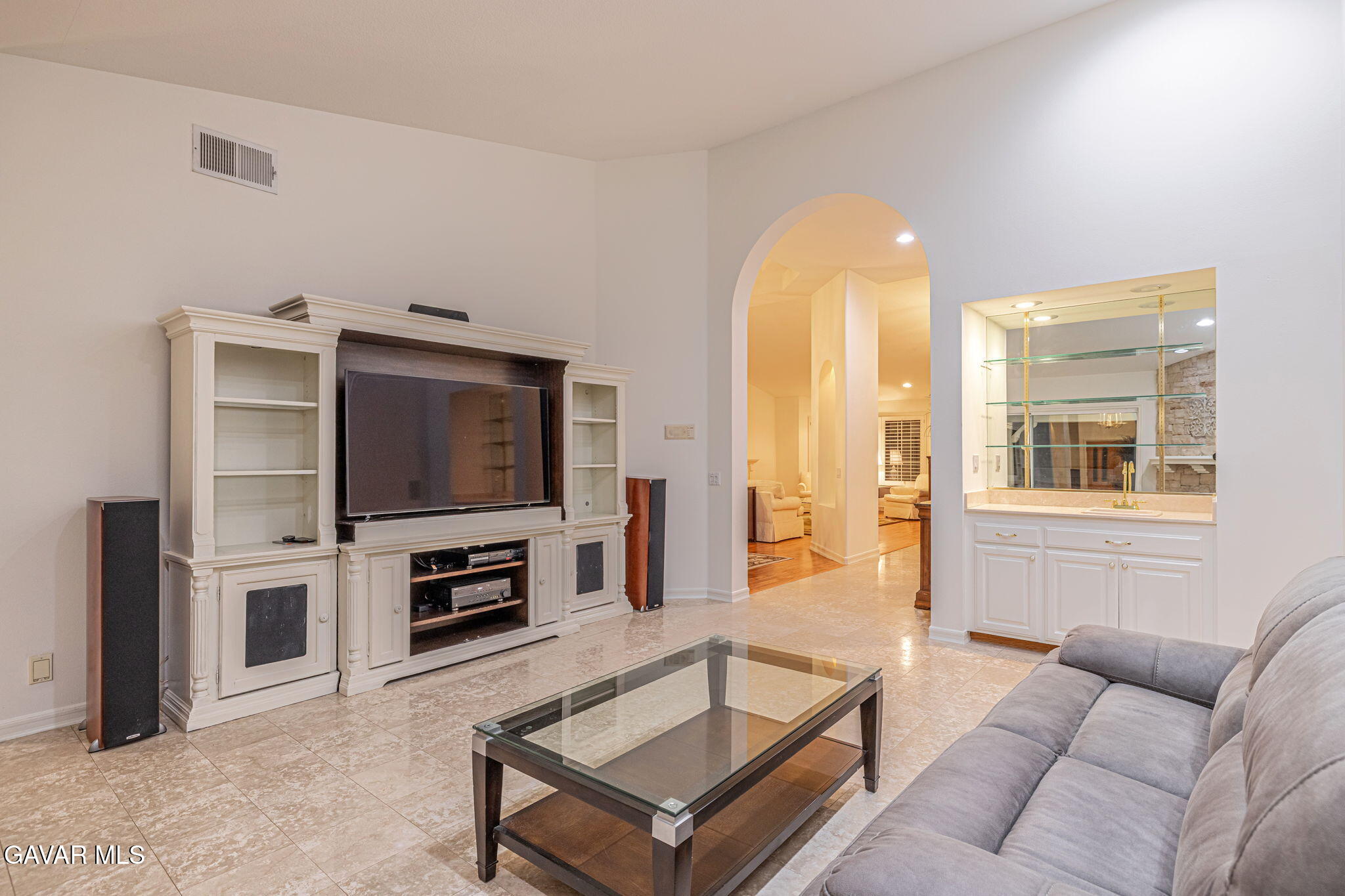 19809 Winged Foot Way Porter Ranch, CA 91326 - Photo 19 of 70 a living room with furniture a flat screen tv and a fireplace