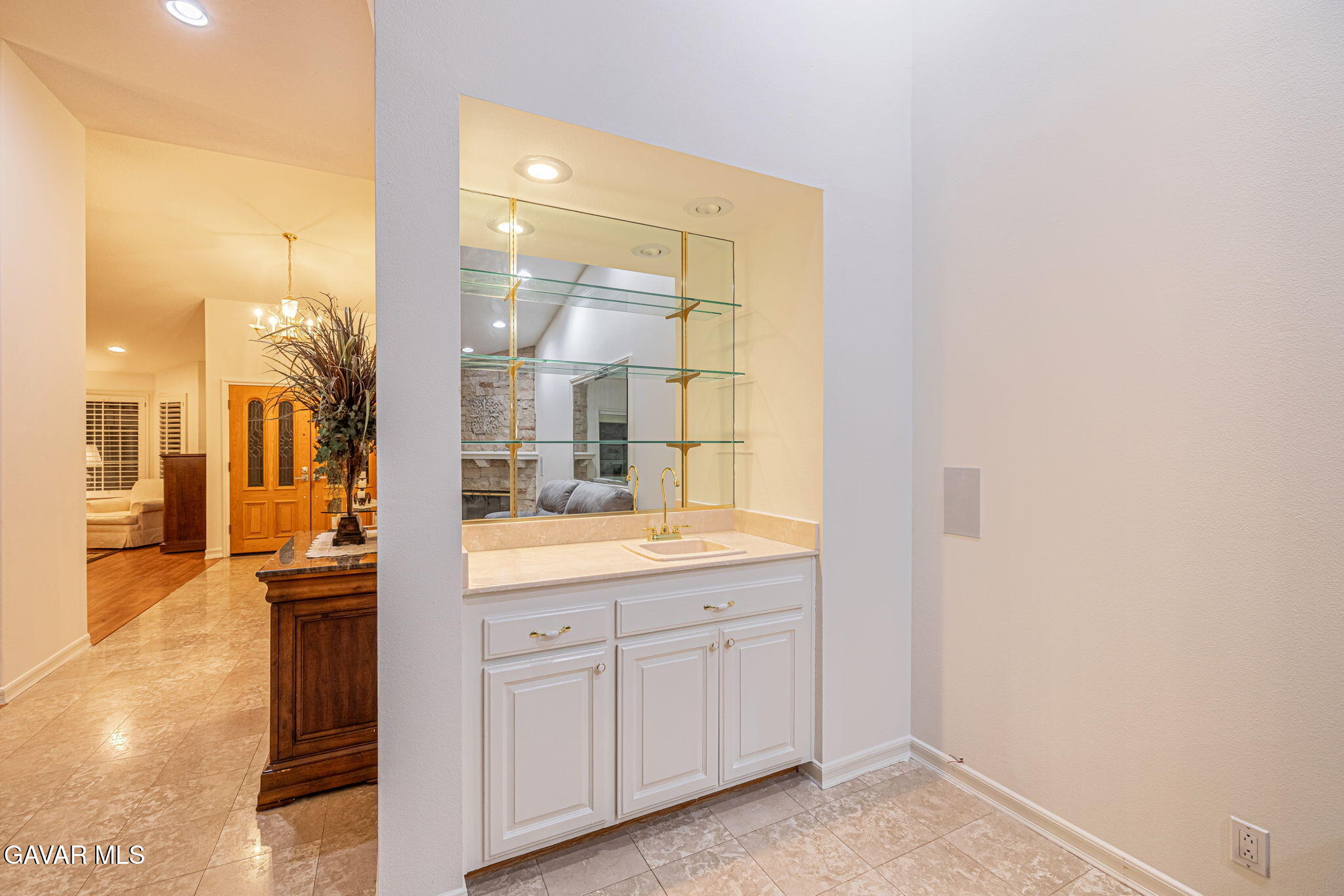 19809 Winged Foot Way Porter Ranch, CA 91326 - Photo 20 of 70 a bathroom with a granite countertop sink and a mirror