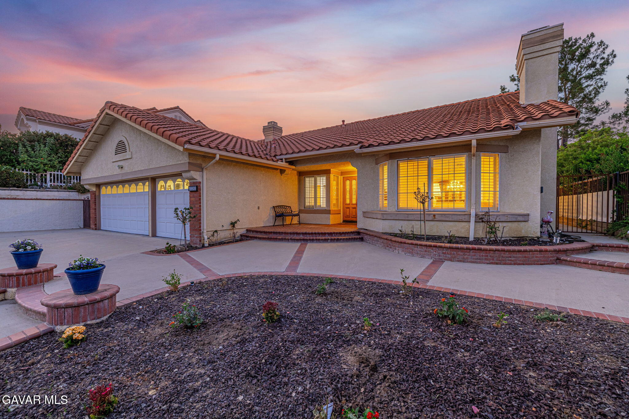 19809 Winged Foot Way Porter Ranch, CA 91326 - Photo 2 of 70 a front view of a house with garden