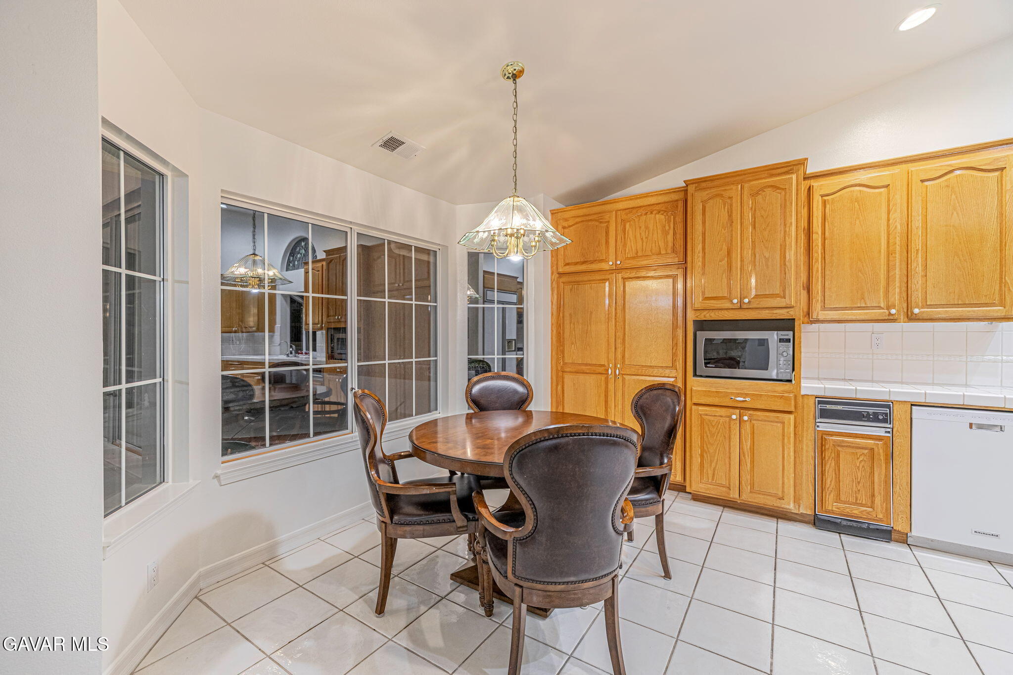 19809 Winged Foot Way Porter Ranch, CA 91326 - Photo 21 of 70 a dining room with furniture a chandelier and window