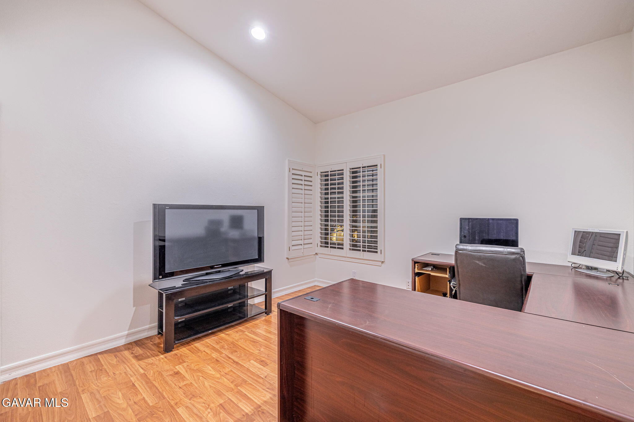 19809 Winged Foot Way Porter Ranch, CA 91326 - Photo 25 of 70 a view of workspace with furniture flat screen tv and window