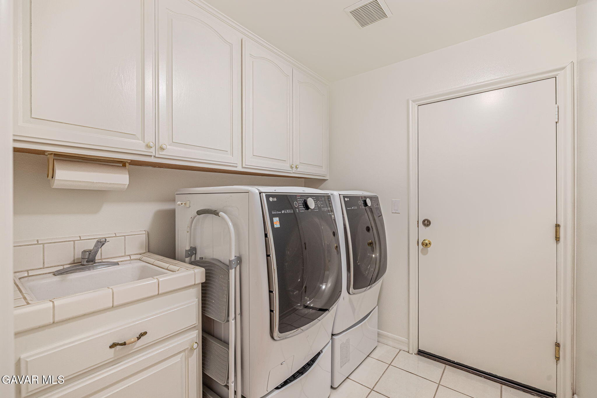 19809 Winged Foot Way Porter Ranch, CA 91326 - Photo 27 of 70 a utility room with dryer and washer