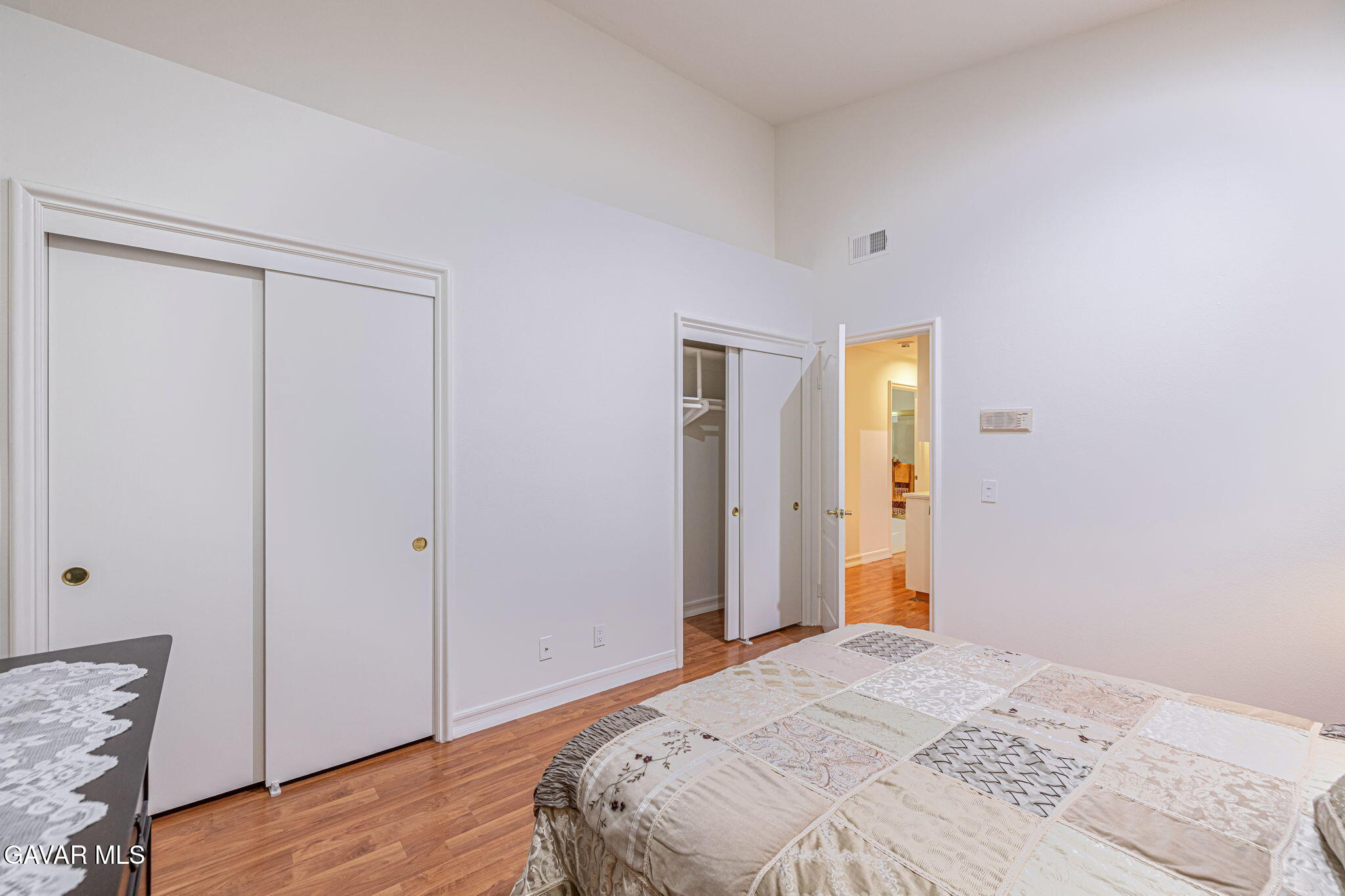 19809 Winged Foot Way Porter Ranch, CA 91326 - Photo 29 of 70 a bedroom with a bed and wooden floor